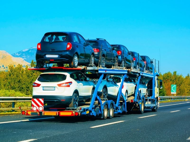 Car carrier hauling vehicles on the highway