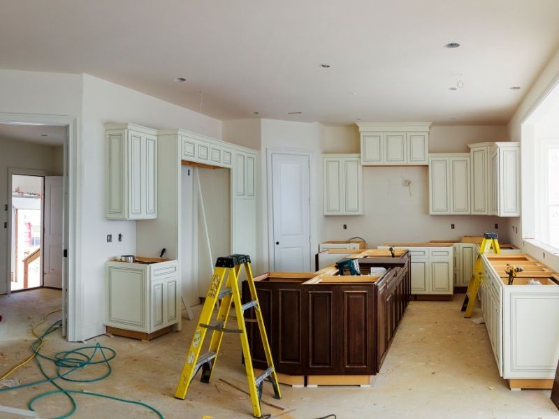 Cabinets being installed during a build